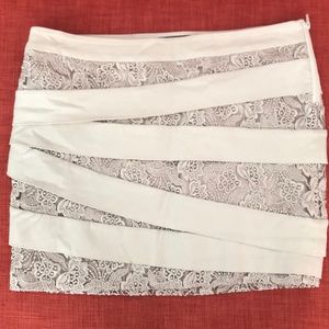 BEBE lace fitted mini skirt
